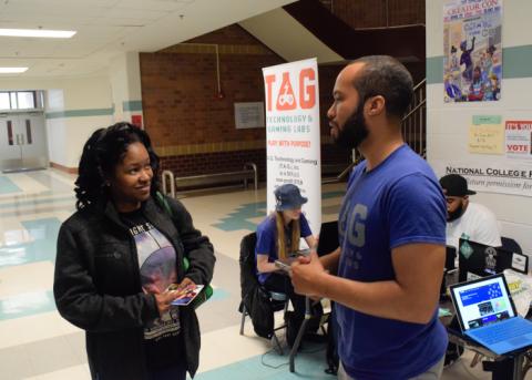Kreston speaking with interested parent