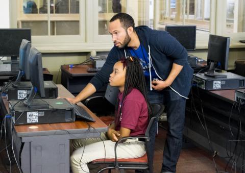 Kreston helping a student