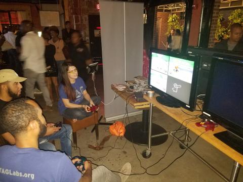 T.A.G. volunteers playing some Mario Kart 64