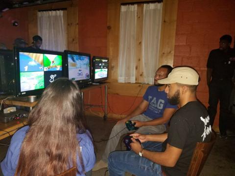 T.A.G. volunteers playing some Mario Kart 64