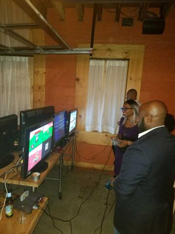 Attendees enjoying retro gaming
